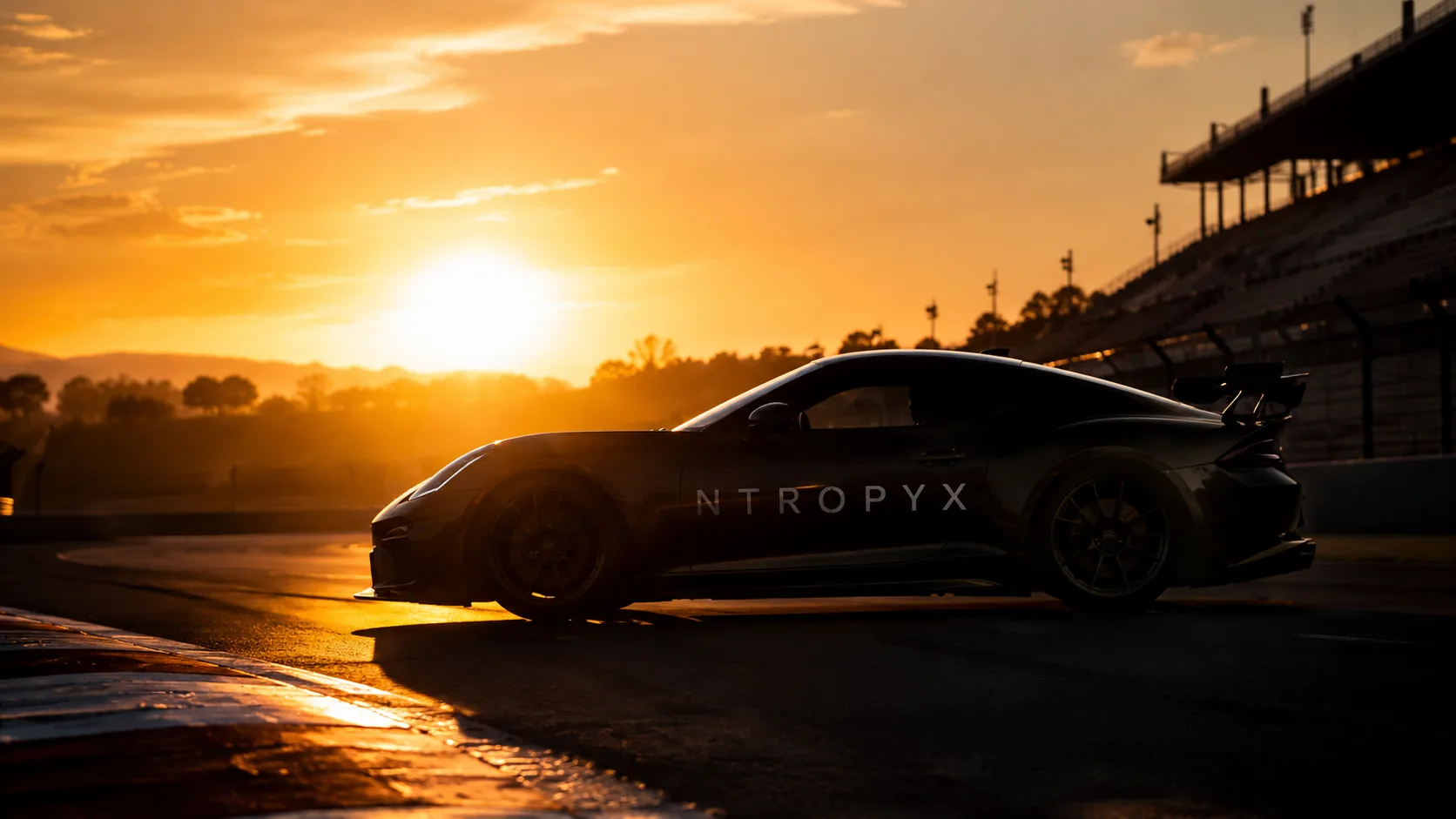 NTROPYX RACE car on track at sunset